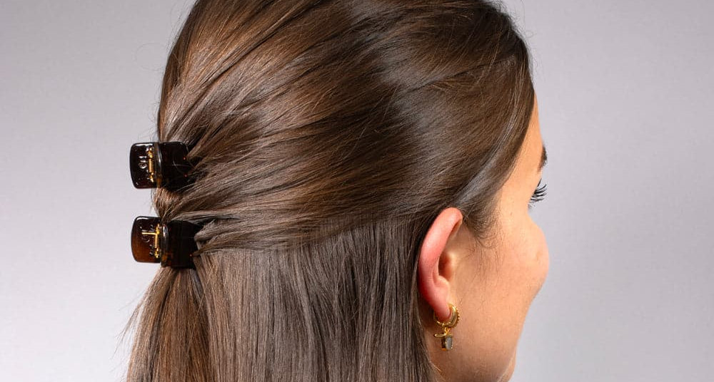 Long brown hair with two TEGEN mini claw clips