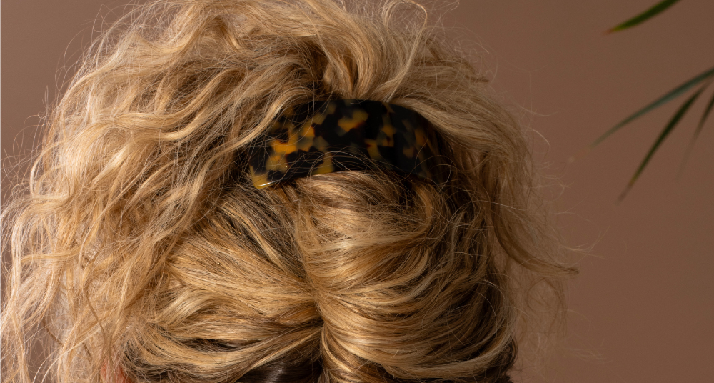 Curly updo held with a TEGEN French Handmade barrette