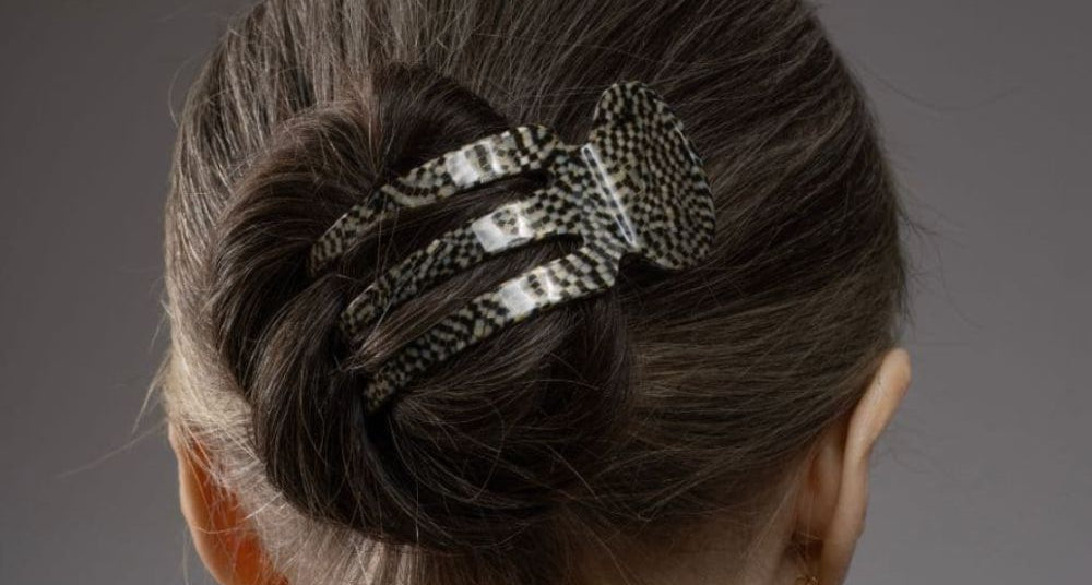 Grey hair in a sleek bun held with a TEGEN French Handmade clip