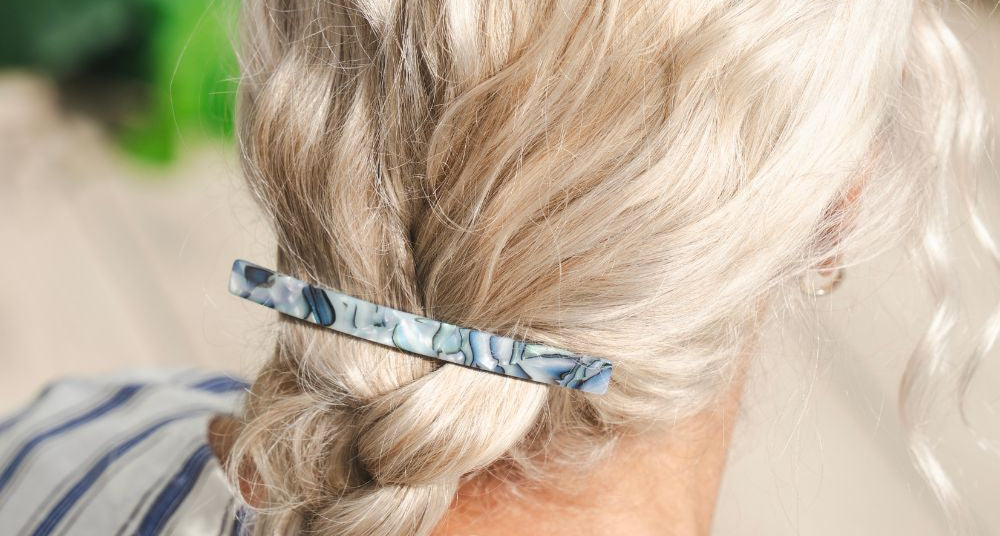 Grey hair in a loose updo with a TEGEN French Handmade barrette